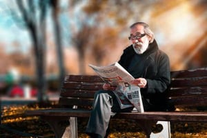 A man reading a newspaper.