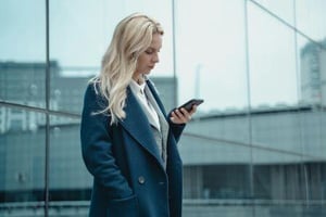 A person checking an email on her phone.