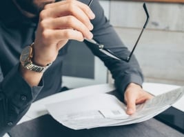 A person looking at a piece of paper.