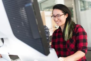 A person looking at an interesting story on a computer.